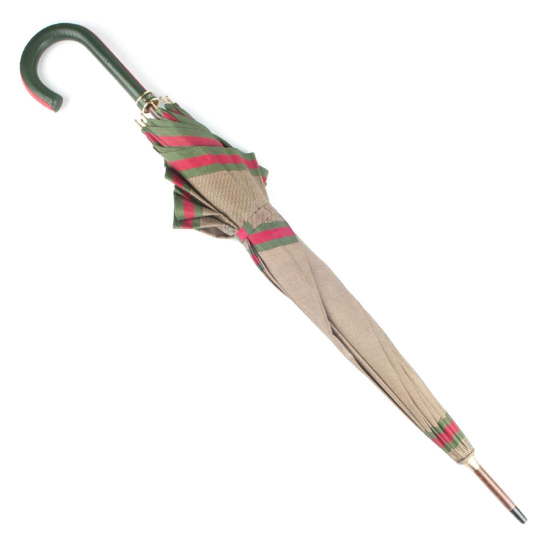 GUCCI , a vintage lightweight umbrella. Designed with a